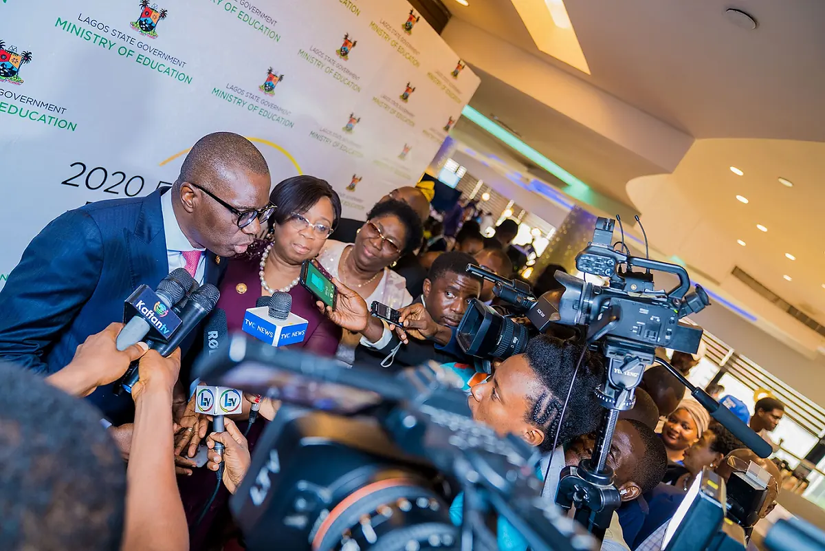 Folasade Adefisayo with Governor Babajide Olusola Sanwo-Olu facing a press pack at a Lagos State Ministry of Education event.